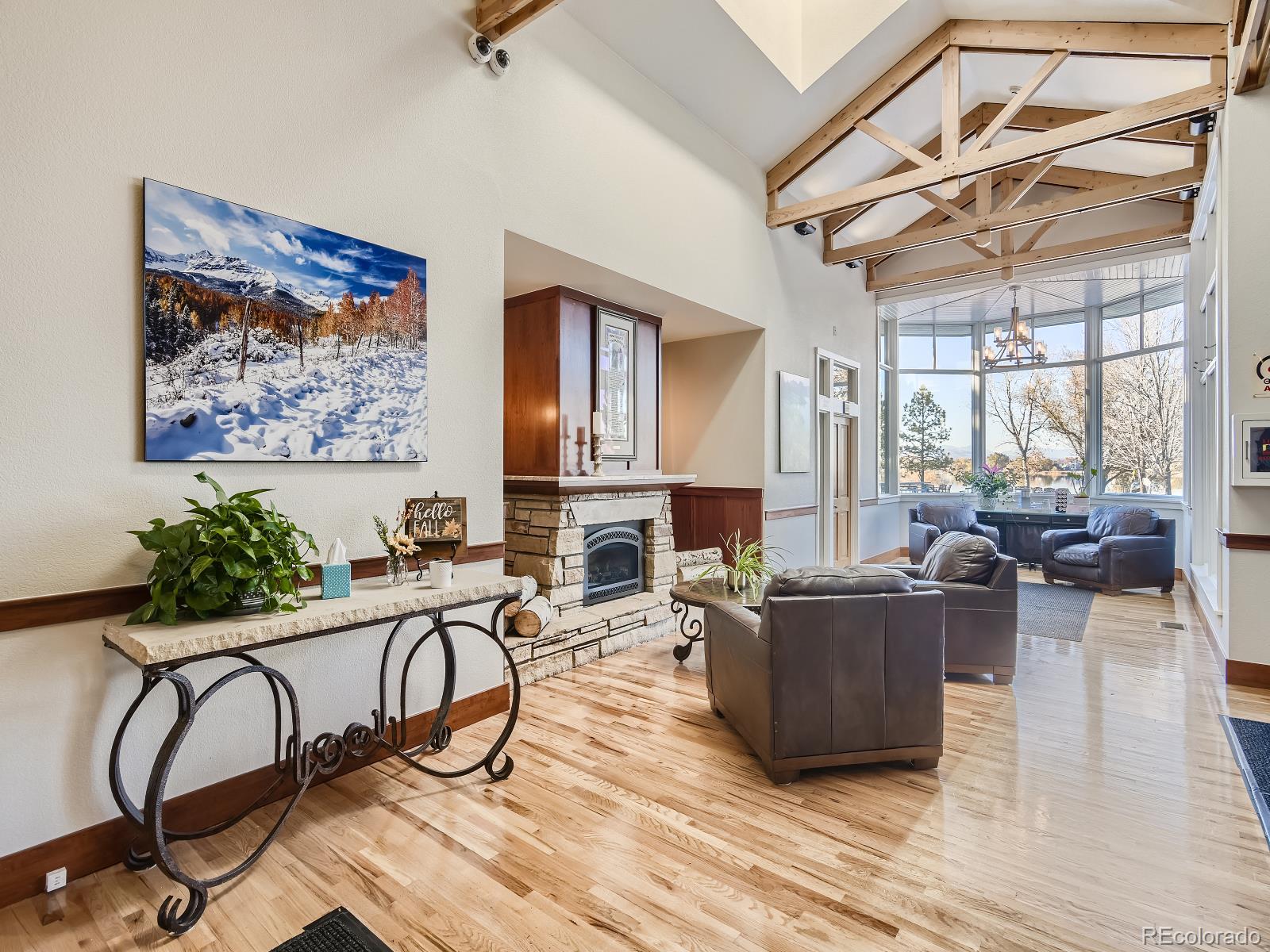 7400 West Grant Ranch Boulevard, Unit 60 Denver, CO 80123 - Photo 28 of 36 a living room with furniture a fireplace and wooden floor