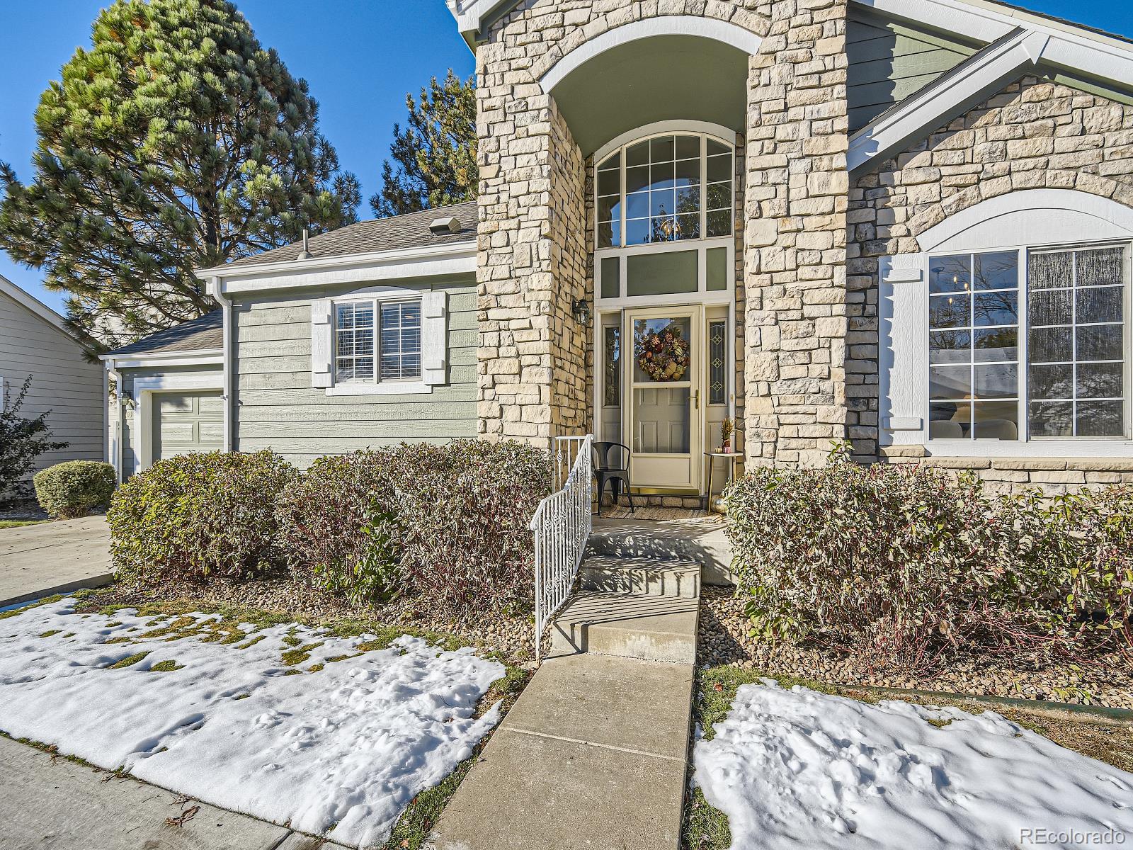 7400 West Grant Ranch Boulevard, Unit 60 Denver, CO 80123 - Photo 3 of 36 a front view of a house
