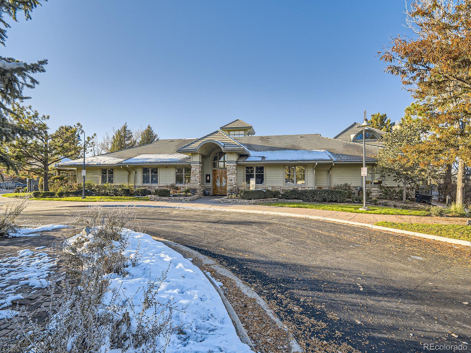 7400 West Grant Ranch Boulevard, Unit 60 Denver, CO 80123 - Photo 33 of 36 a front view of a house with a yard