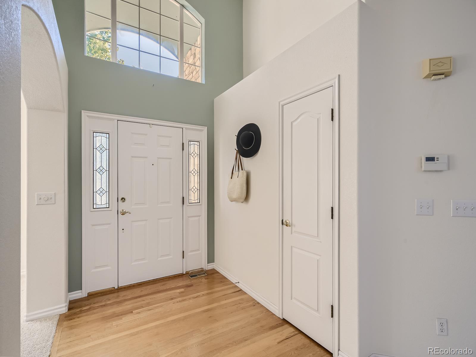 7400 West Grant Ranch Boulevard, Unit 60 Denver, CO 80123 - Photo 4 of 36 a view of a hallway with wooden floor