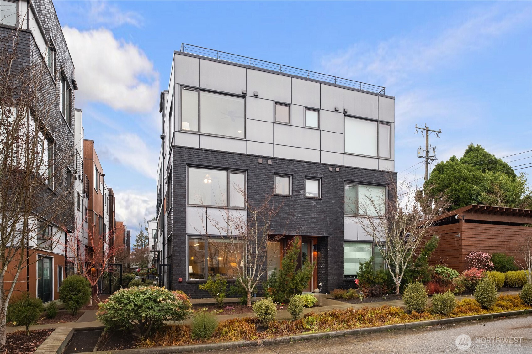 4272 Southwest Bradford Street Seattle, WA 98116 - Photo 2 of 28 a front view of a building with garden