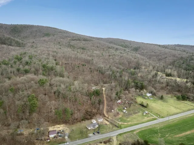 a view of a big yard with an outdoor space