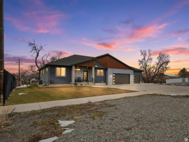175 North 100 West Providence, UT 84332 - Photo 1 of 45 Contemporary home with driveway, board and batten siding, a garage, and covered porch