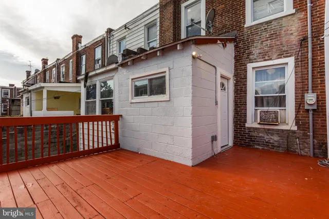 a view of a brick house with many windows