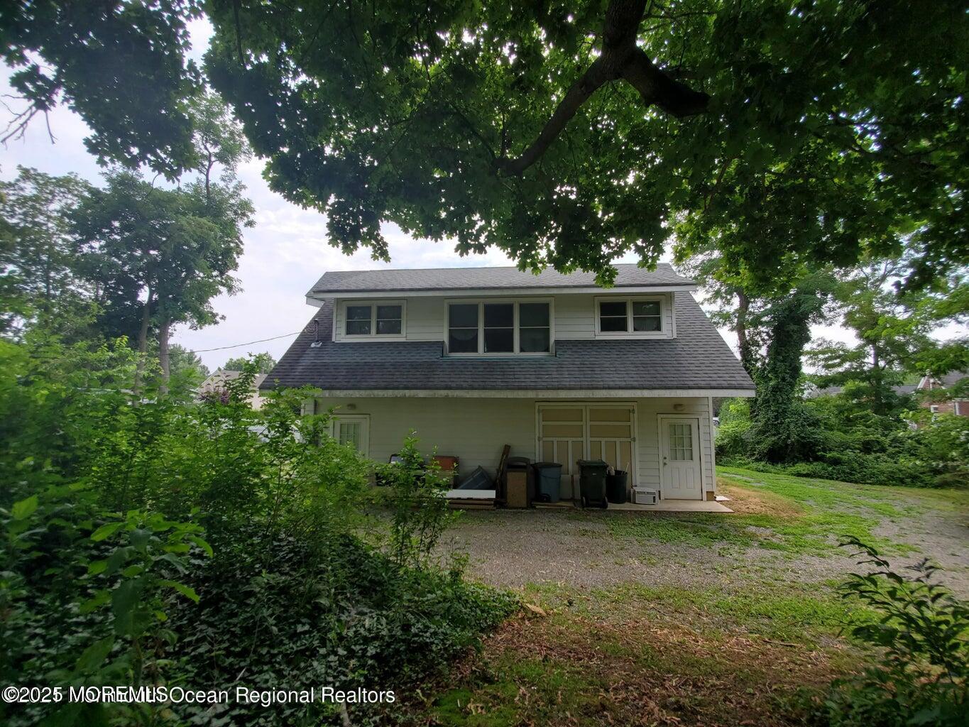 92 Compton Street Belford, NJ 07718 - Photo 12 of 27 a front view of a house with a yard