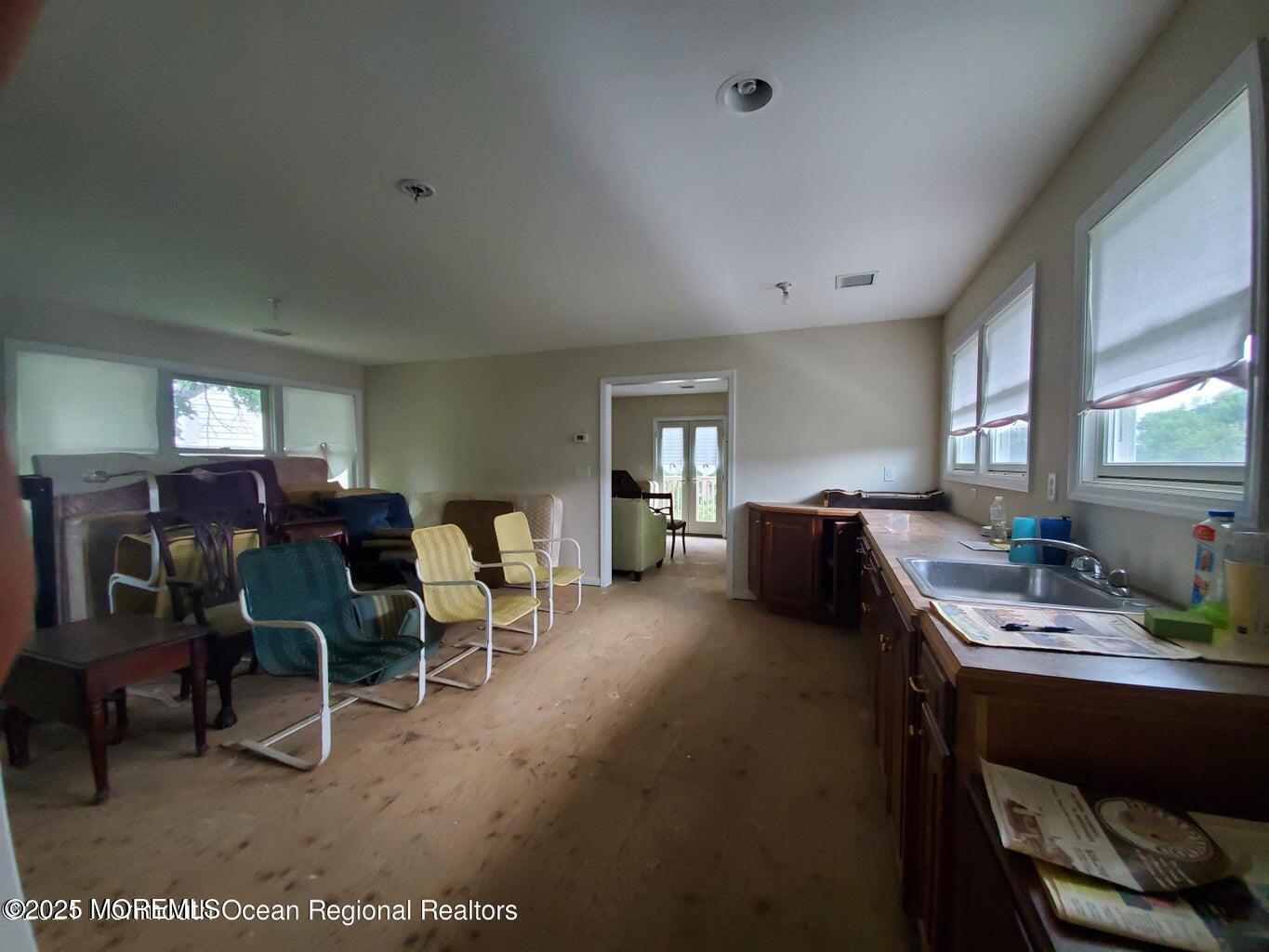 92 Compton Street Belford, NJ 07718 - Photo 15 of 27 a living room with furniture window and wooden floor