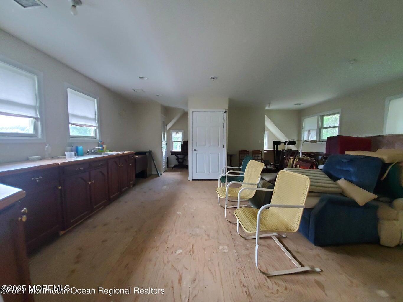 92 Compton Street Belford, NJ 07718 - Photo 16 of 27 a living room with furniture and a area
