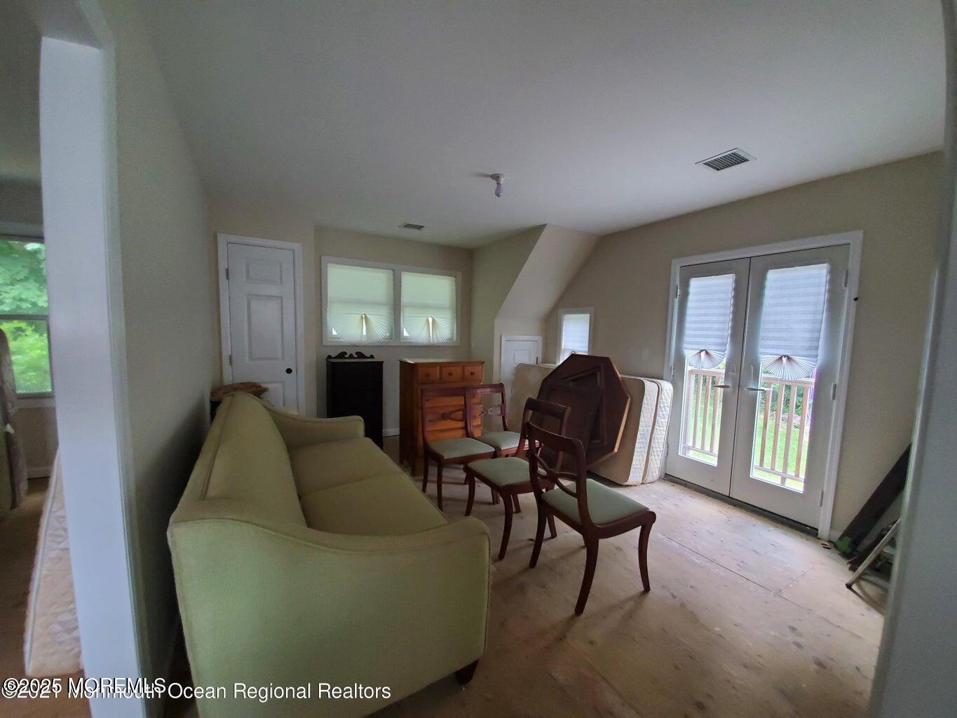 92 Compton Street Belford, NJ 07718 - Photo 18 of 27 a living room with furniture and a window