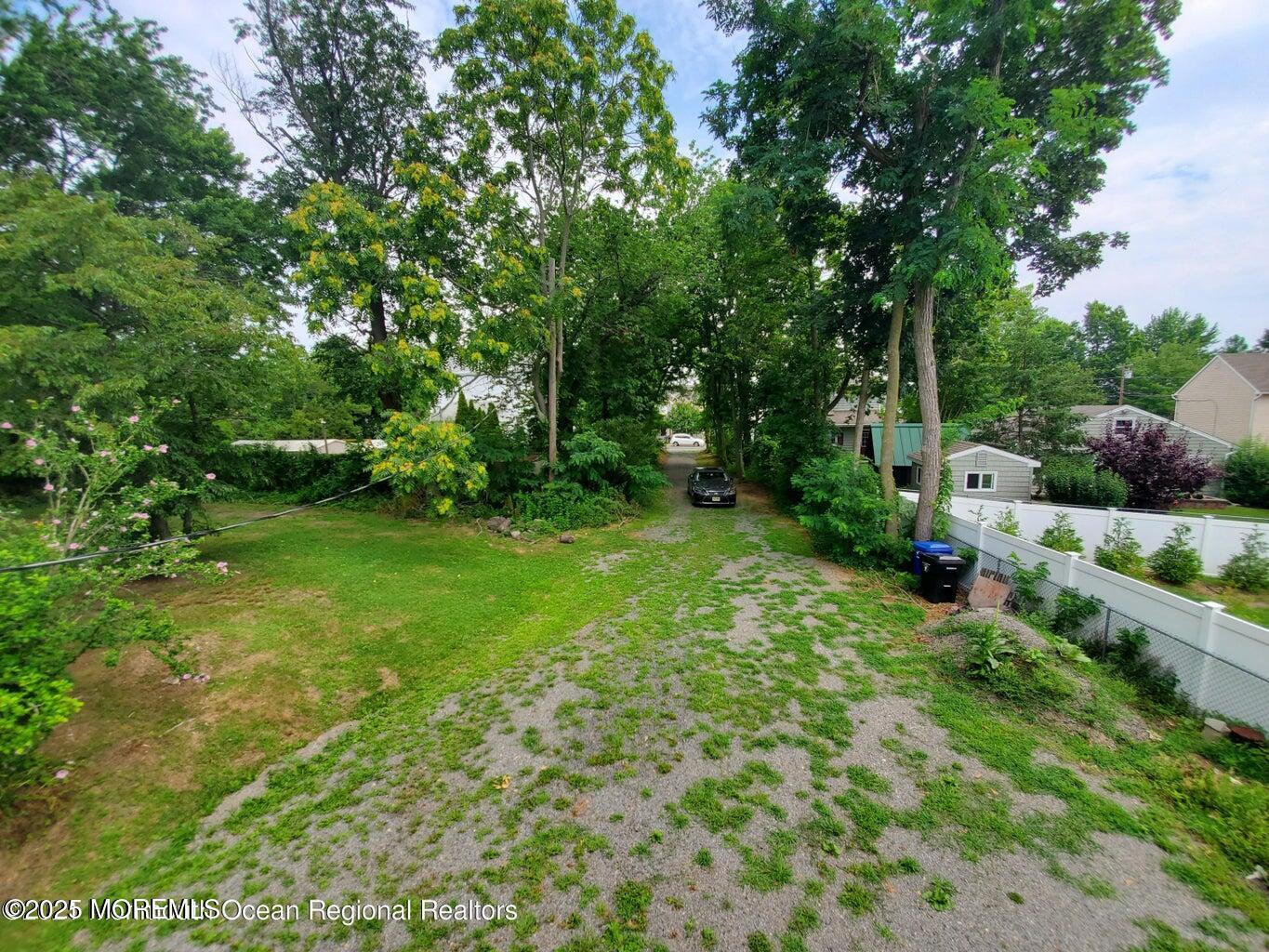 92 Compton Street Belford, NJ 07718 - Photo 21 of 27 a view of backyard with green space