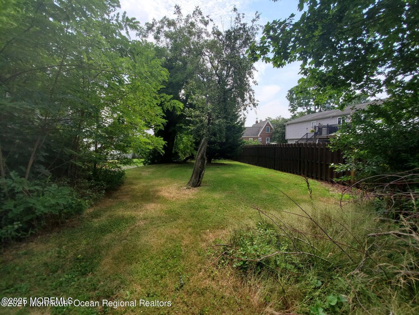 92 Compton Street Belford, NJ 07718 - Photo 8 of 27 a backyard of a house with lots of green space