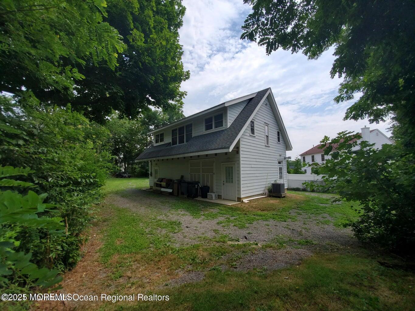 92 Compton Street Belford, NJ 07718 - Photo 9 of 27 a view of a house with a yard