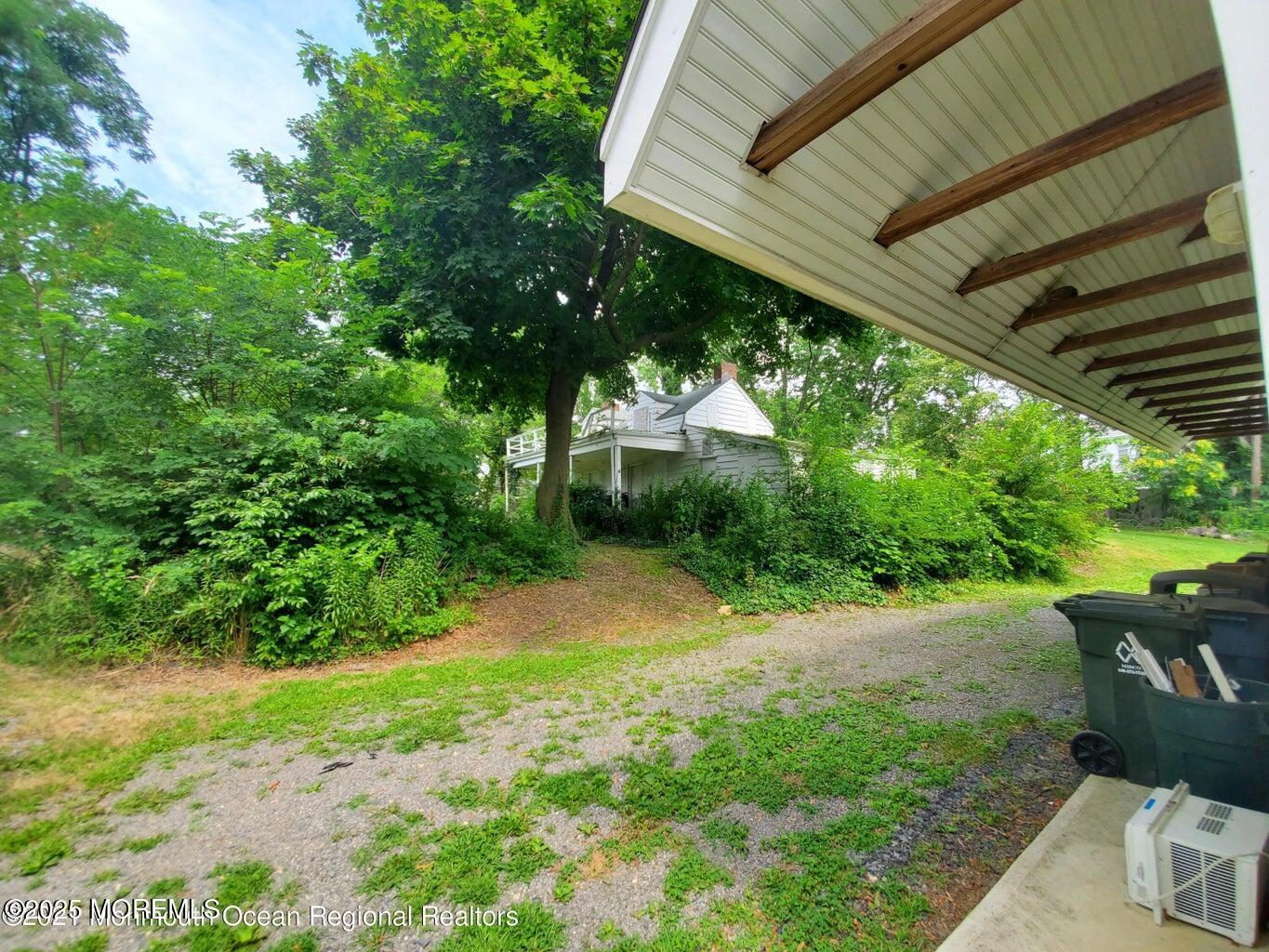 92 Compton Street Belford, NJ 07718 - Photo 10 of 27 a backyard of a house with lots of green space