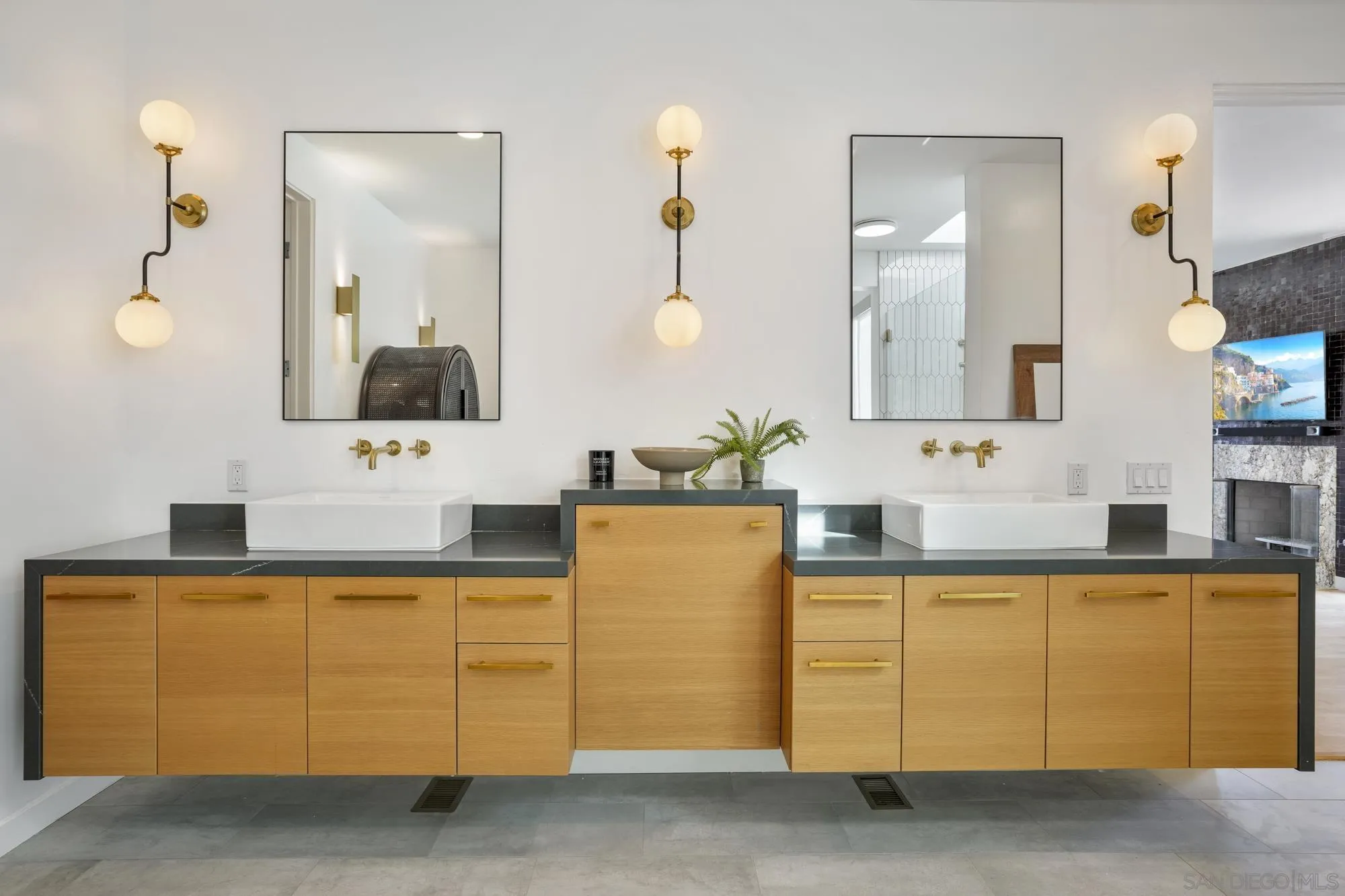 2844 Gate 2 Place Chula Vista, CA 91914 - Photo 22 of 65 a bathroom with a sink vanity and mirror