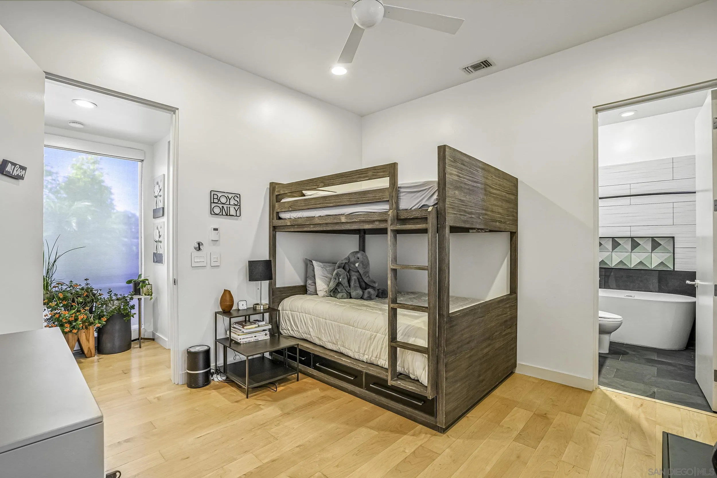 2844 Gate 2 Place Chula Vista, CA 91914 - Photo 32 of 65 a bedroom with a bed and a potted plant