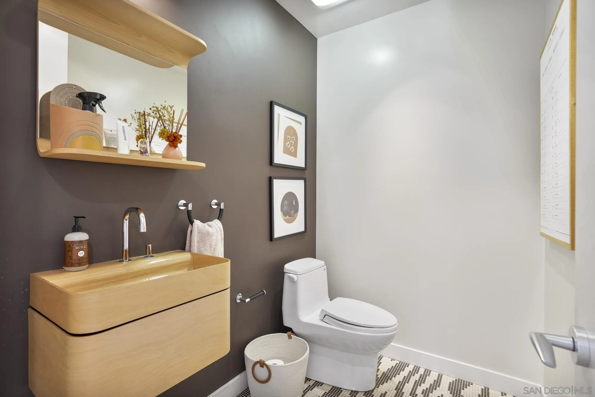 2844 Gate 2 Place Chula Vista, CA 91914 - Photo 36 of 65 a bathroom with a toilet a sink and mirror