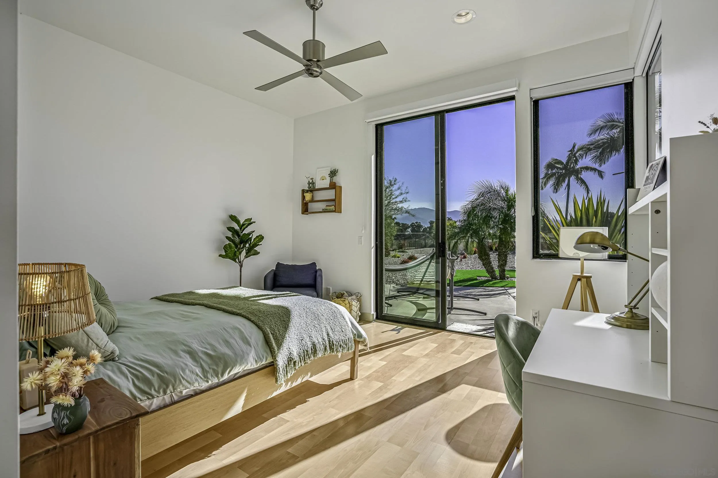 2844 Gate 2 Place Chula Vista, CA 91914 - Photo 38 of 65 a bedroom with a large bed and a chandelier