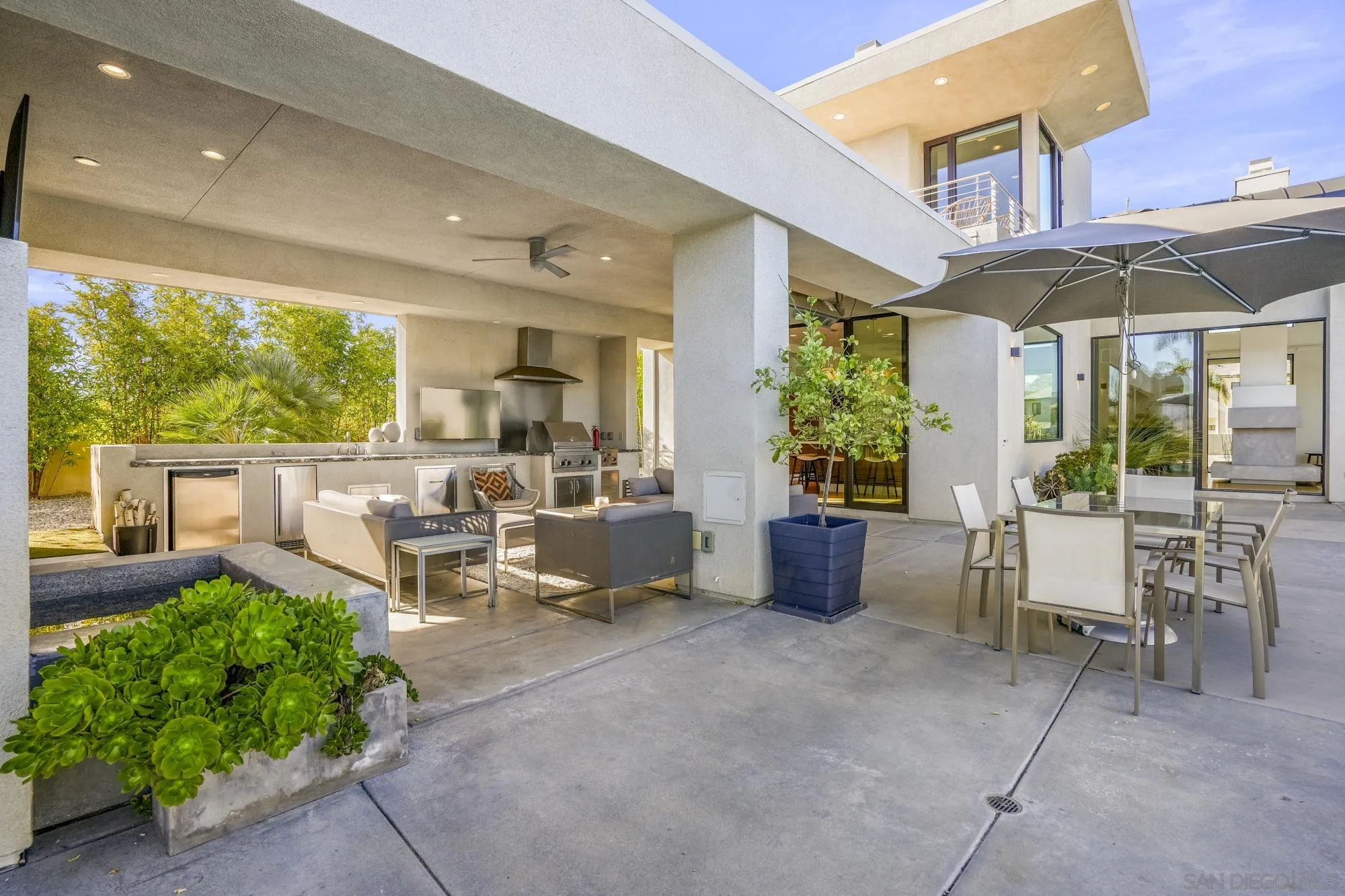 2844 Gate 2 Place Chula Vista, CA 91914 - Photo 43 of 65 a view of a patio with a dining table and chairs