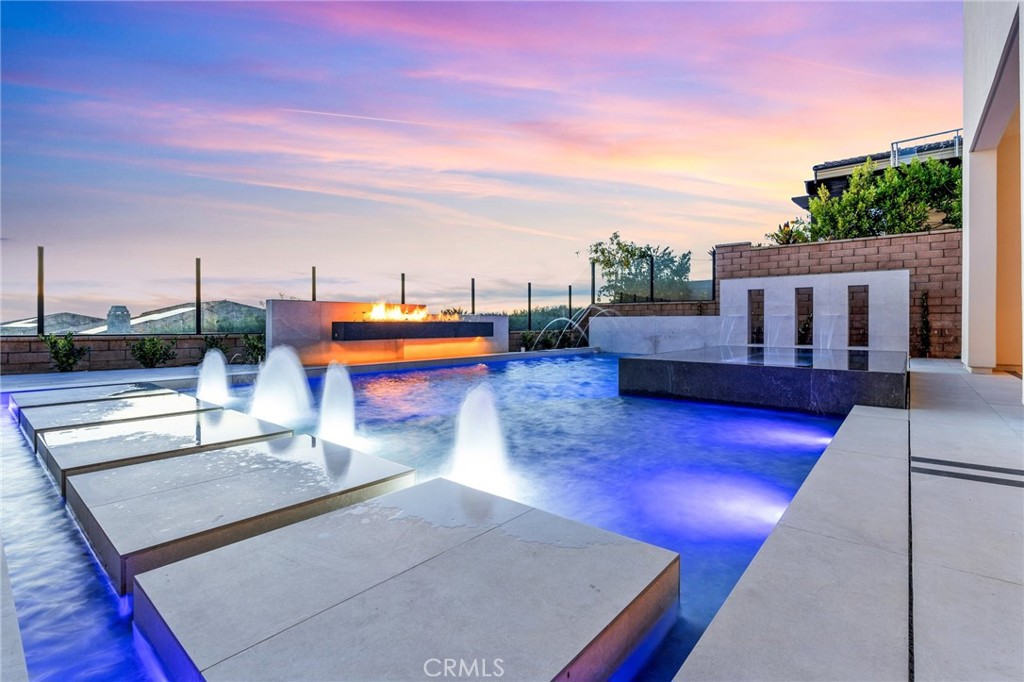 112 Clear Falls Irvine, CA 92602 - Photo 1 of 62 a view of a swimming pool with a lounge chairs