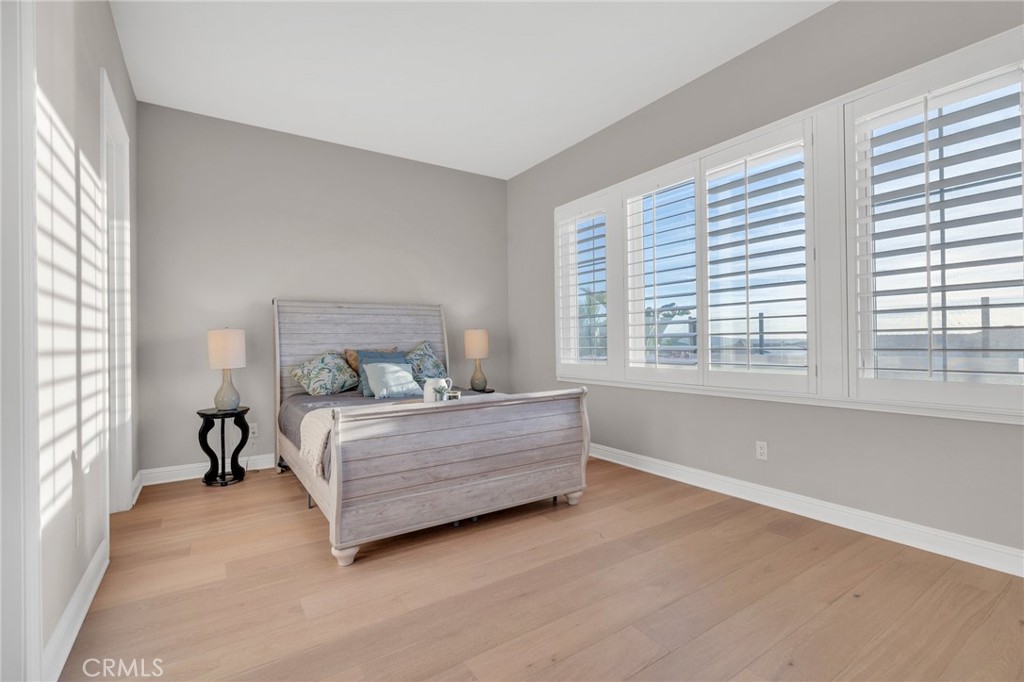 112 Clear Falls Irvine, CA 92602 - Photo 20 of 62 a bed room with a bed and a large window