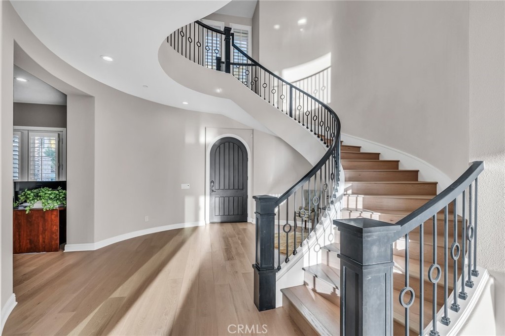 112 Clear Falls Irvine, CA 92602 - Photo 26 of 62 a view of entryway and hall with wooden floor