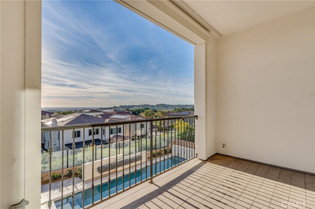 112 Clear Falls Irvine, CA 92602 - Photo 39 of 62 a view of a balcony with a floor to ceiling window and wooden floor