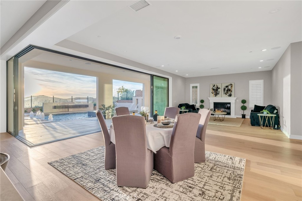 112 Clear Falls Irvine, CA 92602 - Photo 9 of 62 a view of a dining room with furniture wooden floor and a rug