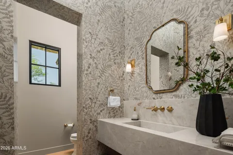 a bathroom with a sink and mirror