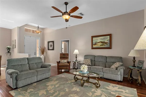 a bedroom with a bed and dresser with mirror