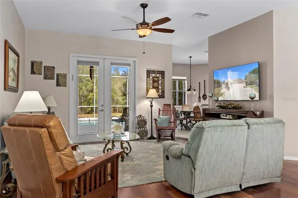 a view of a room with wooden floor and windows