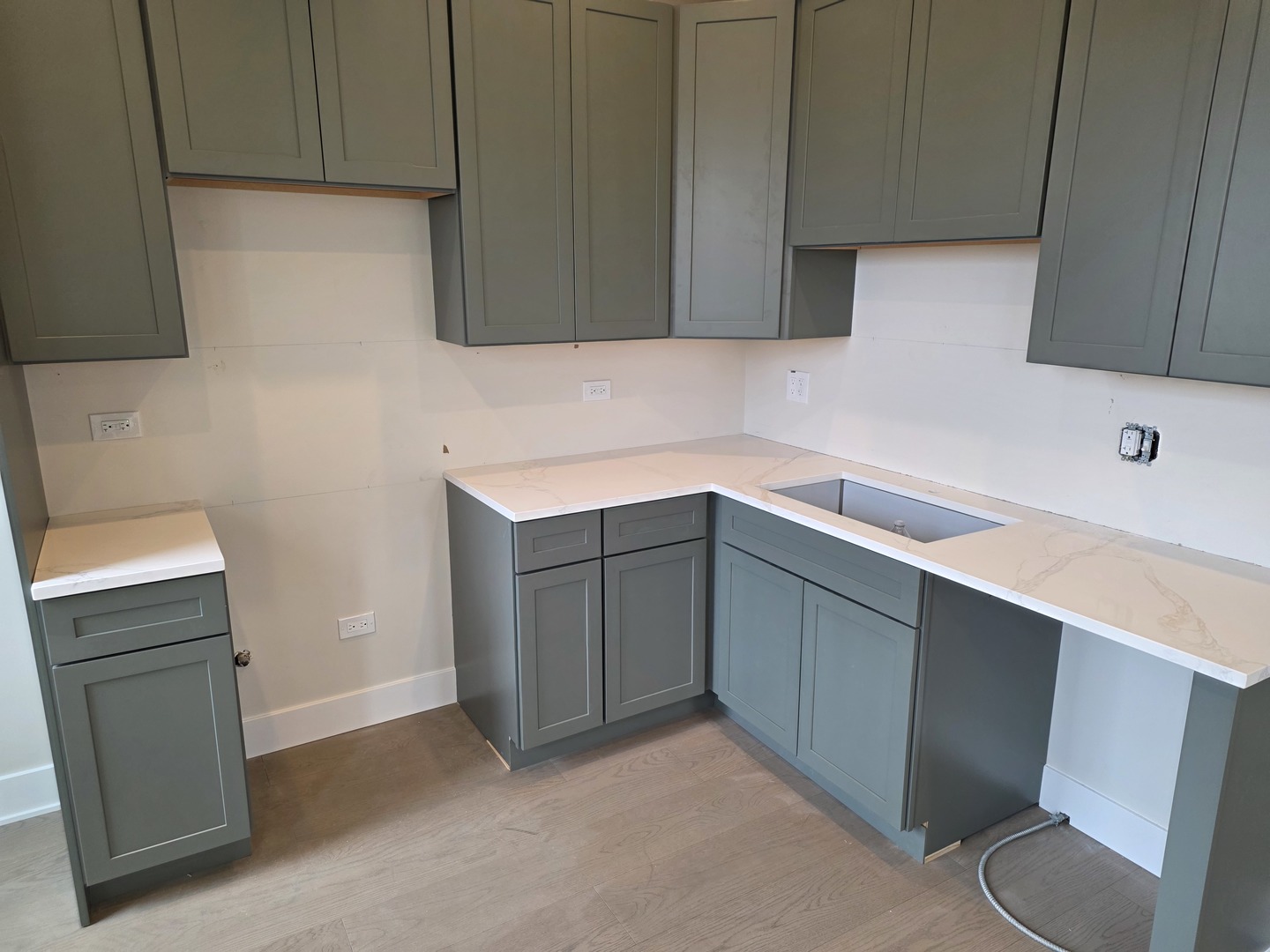 3216 South Morgan Street, Unit 2F Chicago, IL 60608 - Photo 6 of 9 a kitchen with a sink cabinets and toilet