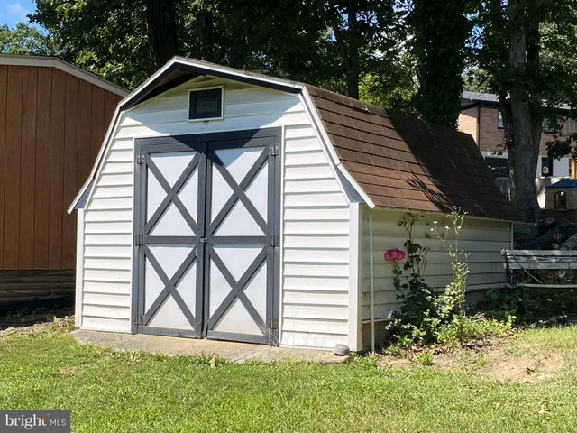 an aerial view of a house with a yard basket ball court and outdoor seating