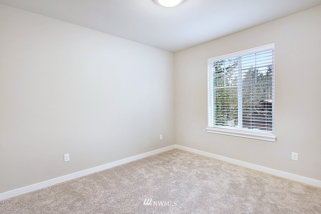 17716 Clover Road Bothell, WA 98012 - Photo 14 of 18 an empty room with a window