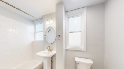 26 Chelsea Street, Unit 3 Boston, MA 02128 - Photo 3 of 3 a bathroom with a sink and a mirror