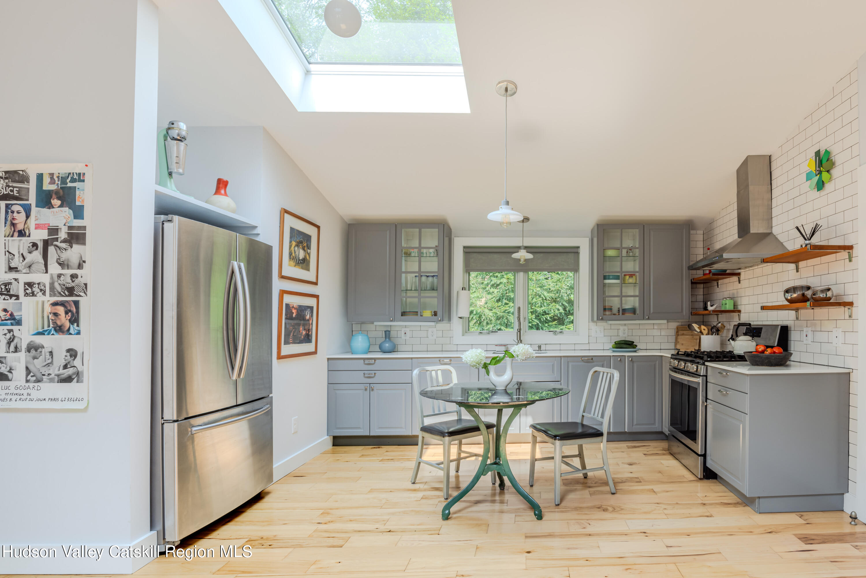 15 Bakertown Road, Unit EASEMENT OFF BAKERTOWN Accord, NY 12404 - Photo 7 of 22 a kitchen with stainless steel appliances a refrigerator a stove a sink a dining table and chairs
