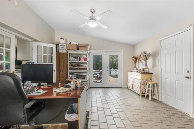 a room with furniture a piano and a bookshelf