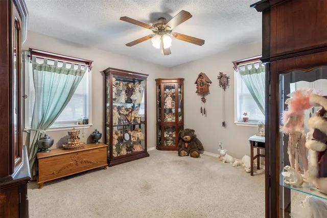 a bedroom with furniture and a window