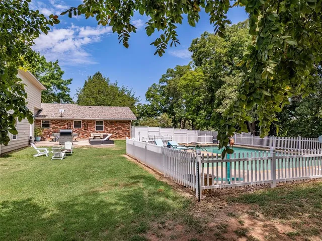 a view of a deck and a backyard