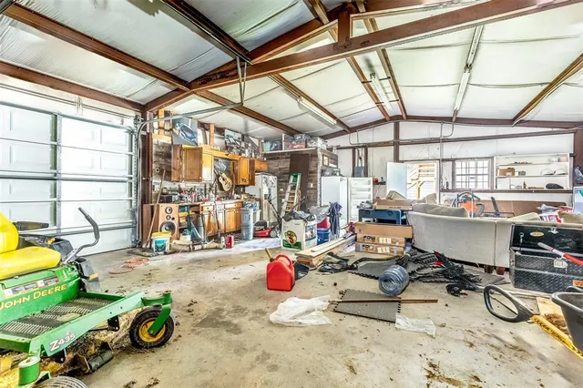 a room with gym equipment and a view of living room