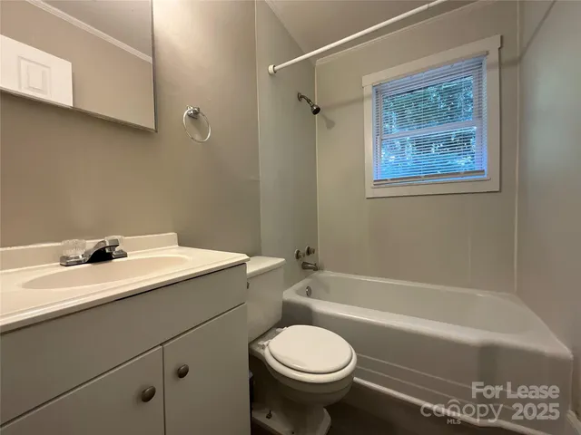 a bathroom with a sink a toilet and a bathtub