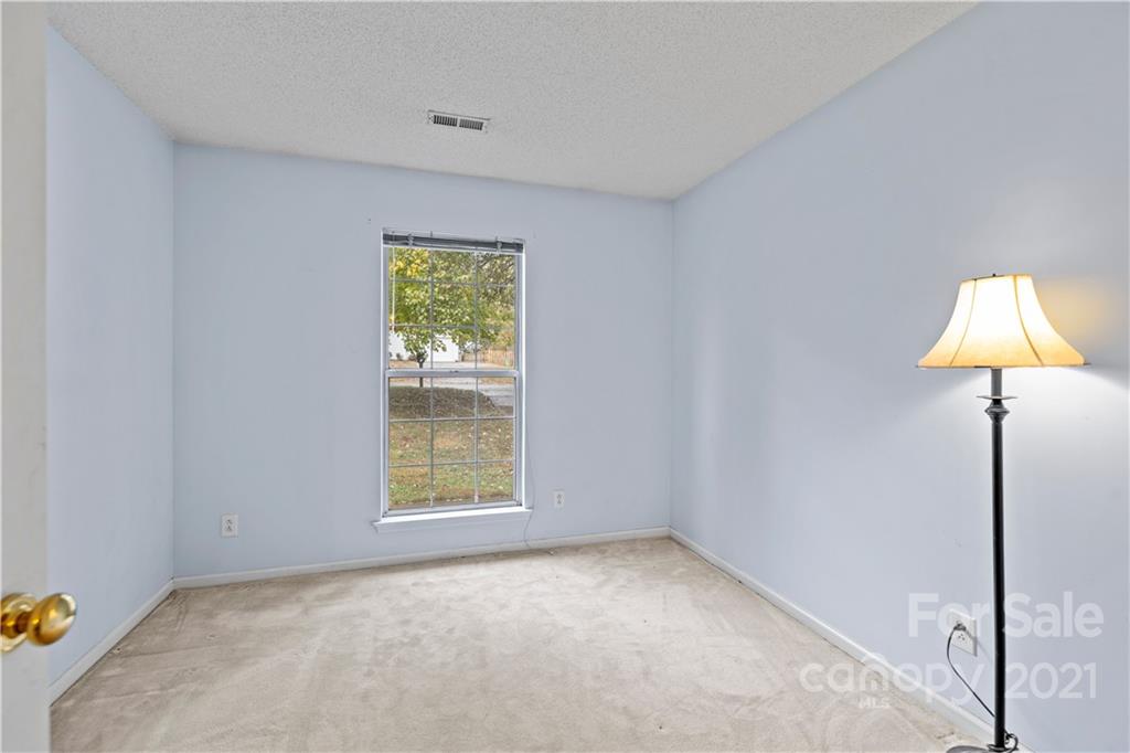11232 Clayford Ridge Charlotte, NC 28215 - Photo 15 of 22 an empty room with a window