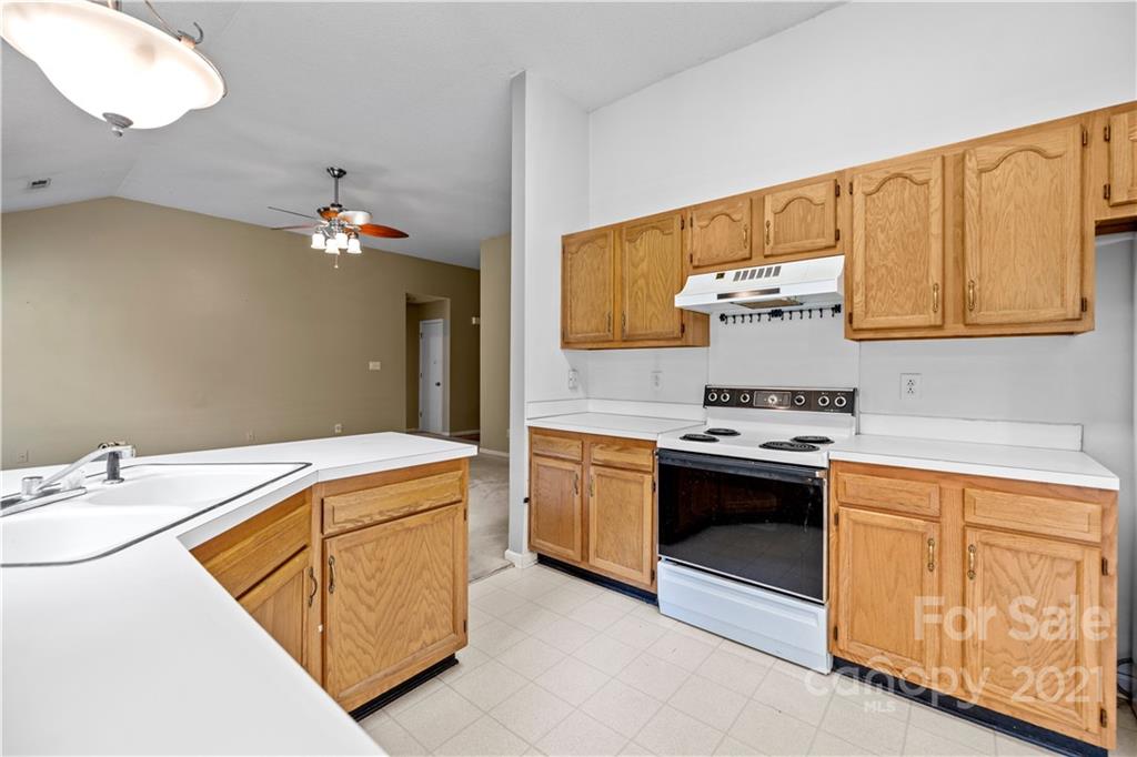 11232 Clayford Ridge Charlotte, NC 28215 - Photo 7 of 22 a kitchen with a sink cabinets and appliances