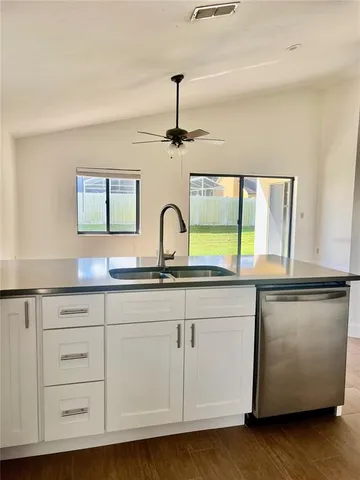 a bathroom with a sink and a window