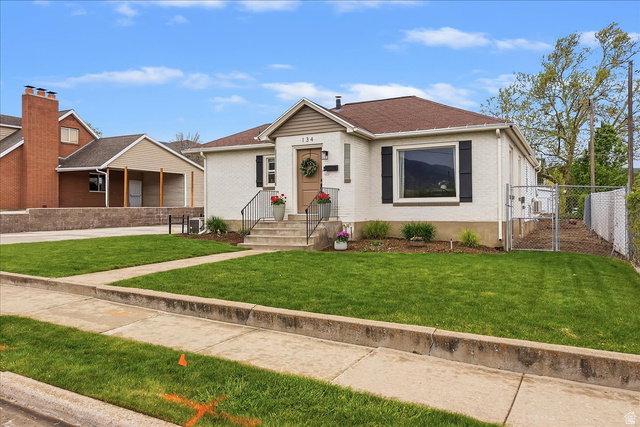 134 East 1000 South Bountiful, UT 84010 - Photo 1 of 1 Bungalow featuring a gate, brick siding, a garage, and a shingled roof