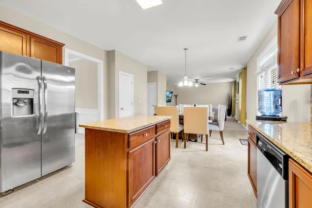 a bedroom with a bed and a dresser in it