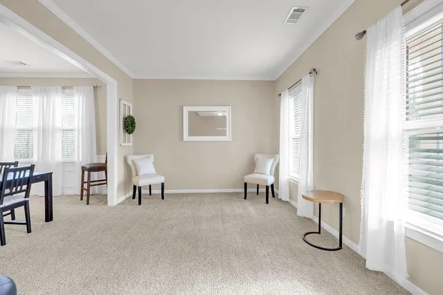 a living room with furniture and a window