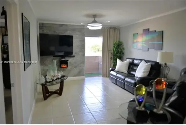 a living room with furniture and a flat screen tv