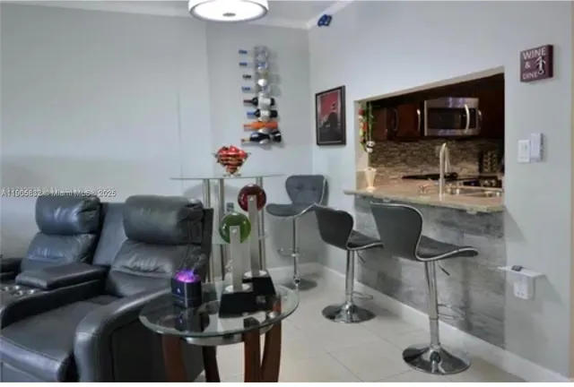 a room with furniture and a flat screen tv