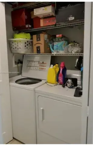 a utility room with washer and dryer