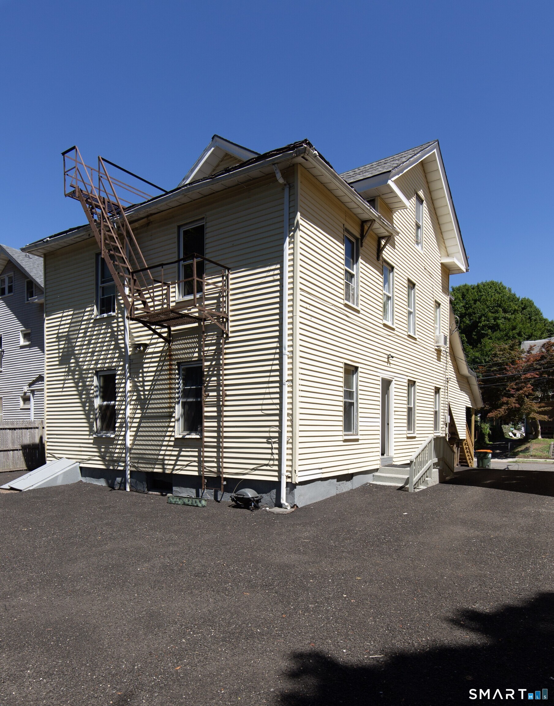 102 Franklin Street Meriden, CT 06450 - Photo 2 of 3 a view of a white house with many windows