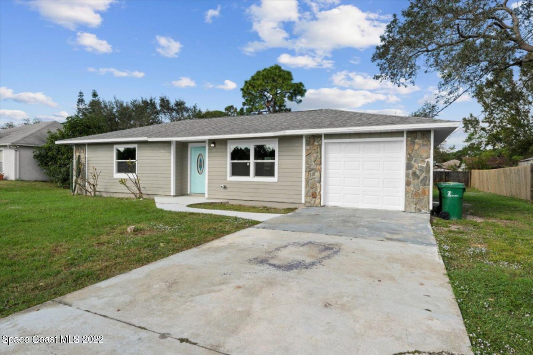4090 Delespine Road Cocoa, FL 32927 - Photo 23 of 26 a front view of house with yard and green space